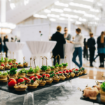 trays of appetizers on a table at an event