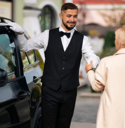 A man providing valet parking services in Houston wearing a vest.